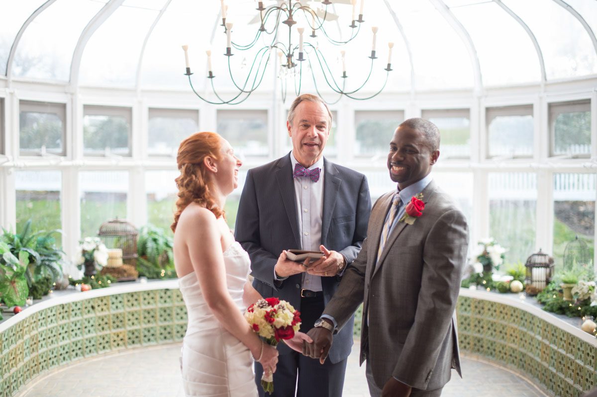 A December Wedding couple lauging at justice of the peace comments