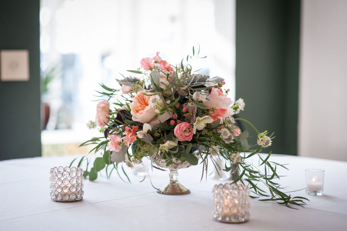 Weddings at Tarrywile soft pink roses with peach peonies in a crystal bowl