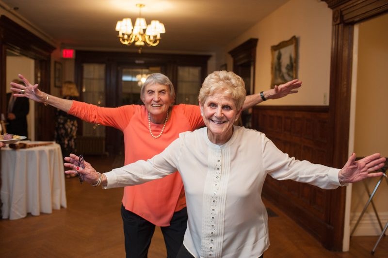 older ladies dancing in the foyer